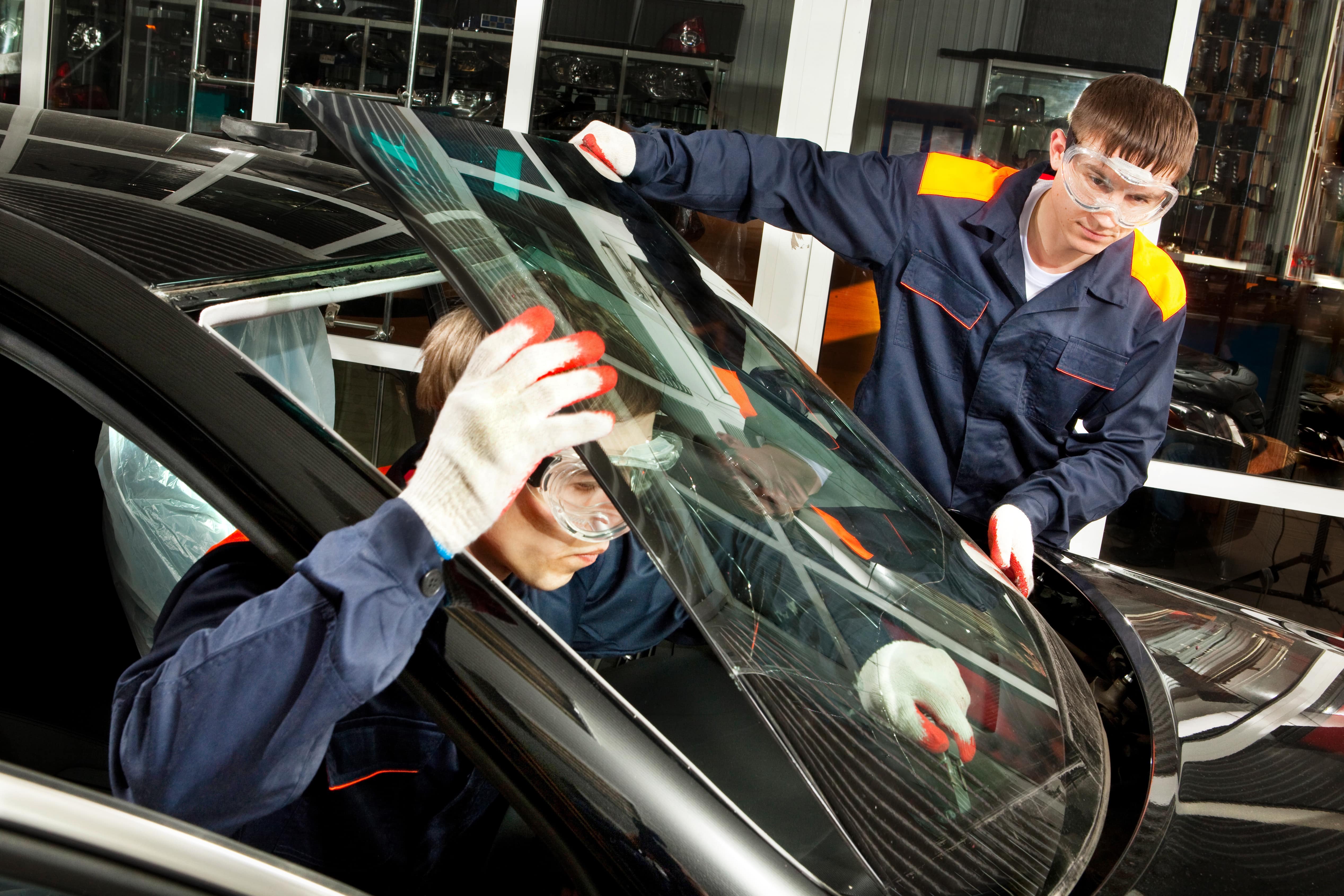 Auto glass technicians installing a windshield in Hampton Roads VA